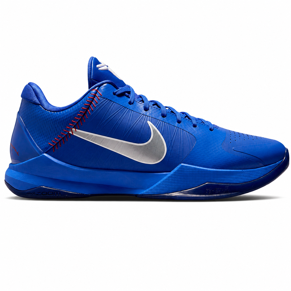 A Nike basketball shoe in vibrant royal blue with a metallic silver Swoosh on the side, red decorative stitching near the heel, and a black outsole, shown against a plain white background.